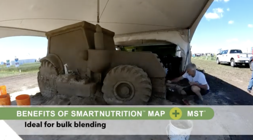 Sand sculpture of a tractor.
